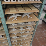w) Molded work left to dry before firing